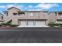 Inviting townhouse complex with attached garages and well-maintained landscaping at 2052 Gravel Hill St # 207, Las Vegas, NV 89117