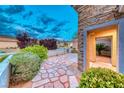 Welcoming front entry featuring stone pathway and well-manicured landscaping enhancing the curb appeal at 2215 Bannerwood St, Henderson, NV 89044