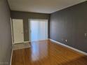 Spacious living room features hardwood floors and sliding glass doors for natural light at 2615 W Gary Ave # 1085, Las Vegas, NV 89123