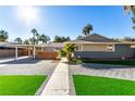 Inviting single-story home with carport, desert landscaping, and brick-paved driveway at 2617 Mason Ave, Las Vegas, NV 89102