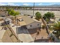 Aerial view of a single-story home with a spacious driveway and detached shed at 2821 Geist Cir, Las Vegas, NV 89115