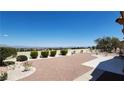 Beautiful backyard with desert landscaping, block wall, and lovely mountain views at 2904 Bow Bridge Dr, Las Vegas, NV 89134