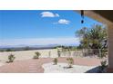This is a spacious backyard with desert landscaping and a covered patio at 2904 Bow Bridge Dr, Las Vegas, NV 89134