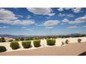 Expansive backyard with desert landscaping, offering serene views of mountains and the valley at 2904 Bow Bridge Dr, Las Vegas, NV 89134