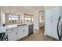 Modern kitchen boasts white cabinets, stainless appliances, and an open layout at 2904 Bow Bridge Dr, Las Vegas, NV 89134