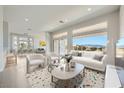 Bright living room with large windows framing mountain views at 2904 Bow Bridge Dr, Las Vegas, NV 89134