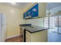 Kitchen features an oven, sleek countertops, and a seamless transition to the outdoor patio via sliding glass doors at 3062 El Camino Ave, Las Vegas, NV 89102