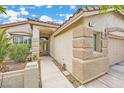 Welcoming front entrance showcasing a decorative glass door and well-maintained landscaping at 417 Carlton Kay Pl, Las Vegas, NV 89144