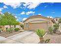 Inviting single-story home featuring a well-manicured desert landscape and a convenient driveway at 417 Carlton Kay Pl, Las Vegas, NV 89144