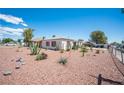 Home with desert landscaping, creating a sustainable and low-water garden at 4412 Baxter Pl, Las Vegas, NV 89107