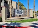 Attractive monument sign made of stone identifying Tuscan Villas Condominiums with manicured lawn at 5055 W Hacienda Ave # 1161, Las Vegas, NV 89118