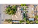 Aerial view of a home with a tile roof, landscaped backyard, horse amenities, and ample space at 5180 N Dapple Gray Rd, Las Vegas, NV 89149