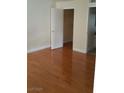 View of bedroom with wood floors and closet at 555 E Silverado Ranch Blvd # 2028, Las Vegas, NV 89183