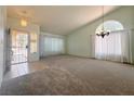 Bright living room with large windows, neutral walls, and an open entryway at 5638 Morning Song Cir, North Las Vegas, NV 89031
