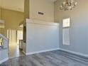 Bright living room with soaring ceilings, clerestory windows and wood-look flooring at 8717 Harvest Valley Ave, Las Vegas, NV 89129
