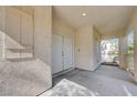 Covered porch with double front doors, security system, and plenty of room for decoration at 9004 Snowtrack Ave, Las Vegas, NV 89149