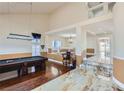 Spacious game room featuring hardwood floors, a pool table, and decorative lighting at 9208 November Breeze St, Las Vegas, NV 89123