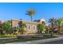 Attractive single-story home with well-maintained landscaping, stone wall, and palm trees at , Las Vegas, NV 89135