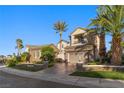 Beautiful two-story home with stone accents, three-car garage, and lush, mature landscaping at , Las Vegas, NV 89135