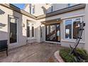 Elegant front entrance featuring a modern door, large windows, and meticulous landscaping at , Las Vegas, NV 89135