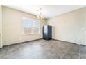 Dining area with tile floors, modern lighting, and large window at 100 Samantha Rose St, Henderson, NV 89012