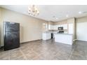 Bright and spacious kitchen featuring white cabinets, modern appliances, and an open floor plan at 100 Samantha Rose St, Henderson, NV 89012