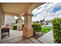Covered porch with stylish supports and well manicured landscaping at 10213 Treasure Mountain Ct, Las Vegas, NV 89129