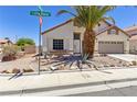 Charming single-story home with desert landscaping and mature palm tree at 1084 Little House Ct, Henderson, NV 89011