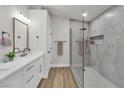 Bathroom features a walk-in shower with glass doors, dual sinks, and modern fixtures at 10886 Porto Foxi St, Las Vegas, NV 89141