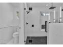 Sleek bathroom featuring a glass enclosed shower with black hardware and floor to ceiling marble tile at 10886 Porto Foxi St, Las Vegas, NV 89141