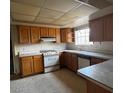 Functional kitchen features lots of cabinet storage and a window above the sink at 1126 Azul Way, Boulder City, NV 89005