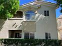 Exterior angle view of a condo building showing the architecture and design elements at 1420 Red Crest Ln # 202, Las Vegas, NV 89144
