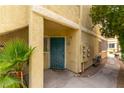 Condo exterior featuring a secure entrance and landscaped surroundings at 1570 Jamielinn Ln # 104, Las Vegas, NV 89110