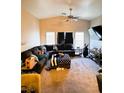 Spacious living room with vaulted ceiling, carpet floors, and plenty of seating at 1612 Lefty Garcia Way, Henderson, NV 89002