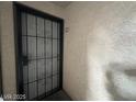 Close up of front door with decorative security gate and unit number 172 above the door at 2606 S Durango Dr # 172, Las Vegas, NV 89117