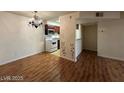 Dining and living room area with wood floors and access to the kitchen at 2606 S Durango Dr # 172, Las Vegas, NV 89117