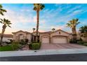 Charming single-story home with three-car garage and desert landscaping, located on a quiet street at 2742 Darby Falls Dr, Las Vegas, NV 89134