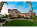 Charming single-story home with well-manicured landscaping, stone accents, and a two-car garage at 2742 Darby Falls Dr, Las Vegas, NV 89134