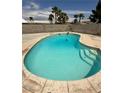 Inviting backyard pool with stairs and concrete surroundings perfect for relaxation at 2804 E Gowan Rd, North Las Vegas, NV 89030