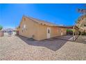 Home featuring a backyard with low-maintenance landscaping and a covered patio at 2809 Mountain Violet Ct, Las Vegas, NV 89108