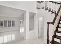 Bright foyer showcasing staircase and open floor plan at 2873 Cambretto Dr, Henderson, NV 89074
