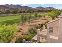 Scenic view of a property overlooking a golf course, mountains, and green vegetation at 2933 Red Springs Dr, Las Vegas, NV 89135