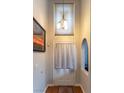 Bright entryway features wood floors, neutral walls, a chandelier and arched entry to another room at 3008 Blue Fin Cir, Las Vegas, NV 89128