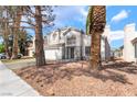 Charming two-story home with a two-car garage and well-maintained front yard landscaping at 3695 Funston Way, Las Vegas, NV 89129