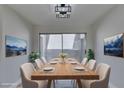 Bright dining room with sliding glass doors leading to the backyard at 3800 Summer Breeze Cir, Las Vegas, NV 89108