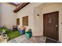 Cozy front porch with decorative tile and charming lighting fixtures at 3987 Saddlewood Ct, Las Vegas, NV 89121
