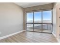 Bedroom with hardwood floors and large windows offering expansive city views at 4471 Dean Martin Dr # 4001, Las Vegas, NV 89103
