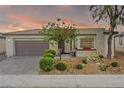 Charming single-story home featuring a desert landscape and two-car garage at 4914 E Beacon Ridge Dr, Pahrump, NV 89061