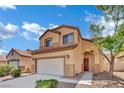 Charming two-story home featuring a desert landscape and attached two-car garage, set in a sunny locale at 6525 Bismark Hills St, North Las Vegas, NV 89084