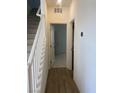 Inviting entryway featuring hardwood floors and a staircase leading to the upper level at 6574 Tumoulin St, Las Vegas, NV 89148